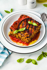 gluten free vegan lasagna. from grilled eggplant, green peas, lentils and vegetables. delicious healthy comfort food for the whole family for the holidays. italian parmigiana