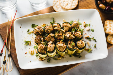 vegan appetizer of grilled zucchini and olive pate on a festive table. healthy food for a family or a party