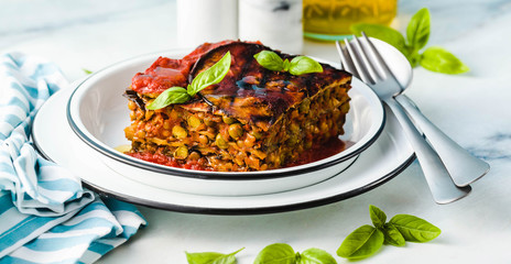 banner of gluten free vegan lasagna. from grilled eggplant, green peas, lentils and vegetables. delicious healthy comfort food for the whole family for the holidays. italian parmigiana