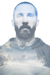 Double exposure portrait of young bearded man and coulds..