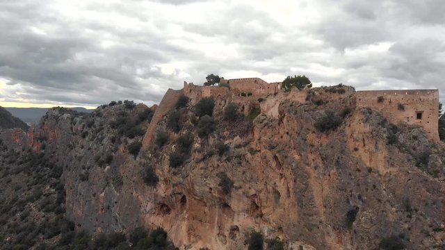 Aerial view of the Castle of Xativa, with cloudy sky.