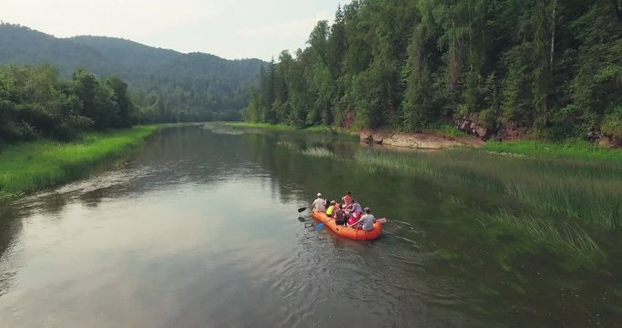 Epic Rafting Two Orange Boat on Shallow Mountain Forest Zilim River in Ural Mountains, Russia at summer sunny day - Aerial view