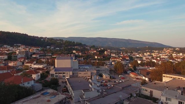 Drone shot rising up above the city of Ulcinj, Montenegro at sunset