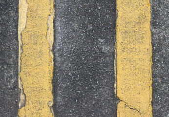 Asphalt background with yellow stripe
