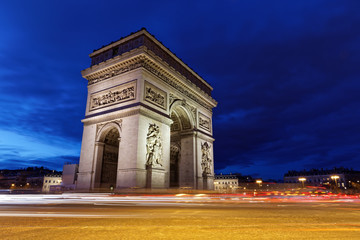 Obraz na płótnie Canvas Arc de Triomphe, Paris, France - March 11, 2018: Arc de Triomphe in Paris at blue hours