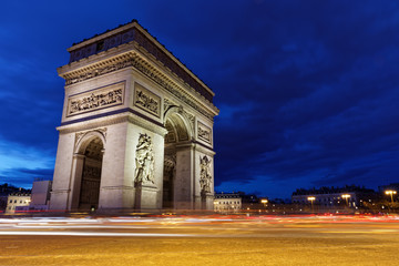 Fototapeta na wymiar Arc de Triomphe, Paris, France - March 11, 2018: Arc de Triomphe in Paris at blue hours