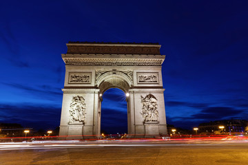Fototapeta na wymiar Arc de Triomphe, Paris, France - March 11, 2018: Arc de Triomphe in Paris at blue hours