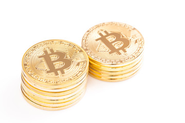 Stack of golden bitcoin on white background