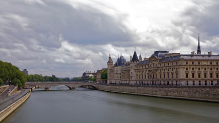 Fototapeta premium Paris, France - May 25, 2018: Castle Conciergerie - former royal palace and jail. Conciergerie located on the west of the Cite Island and today it is part of larger complex known as courthouse