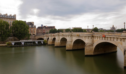 Fototapeta na wymiar Paris, France - May 25, 2018: Pont Neuf in central Paris. The Pont Neuf is the oldest standing bridge across the river Seine in Paris