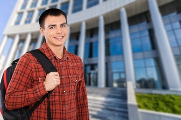 Young man student in red shirt