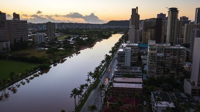 Zoom out sunrise timelapse of the city of Honolulu, Hawaii, USA