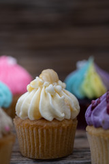 Tasty mini cupcakes on a vintage background, sweet dessert for christmas, new year and valentine holliday