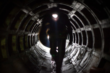 engineer coming through tunnel light