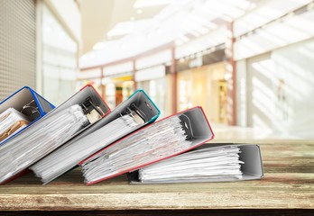 File folders with documents on background