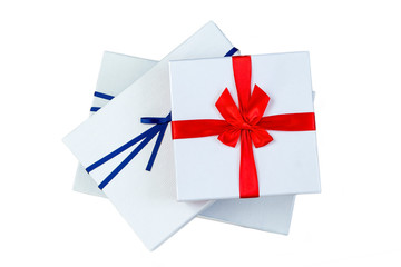 three gift boxes with ribbon blue and red bow on white background.