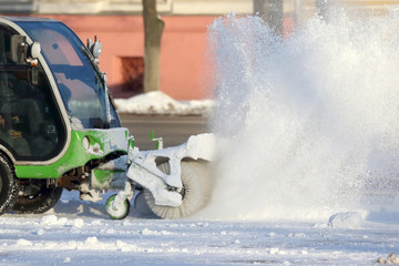 special machine for snow removal cleans the road