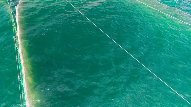 Fishing Nets in the sea water near the coast of the Black Sea in Varna, Bulgaria, aerial drone view.