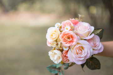 Woman holding a bouquet of roses