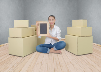 happy woman holding chalkboard, business for delivery object into new home