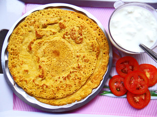 Besan chilla : savory spiced pancakes made with gram flour with chilli sauce and a quick breakfast.