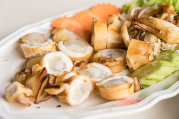 Close up of grilled squid with egg