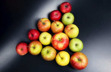 fresh different apples on dark background