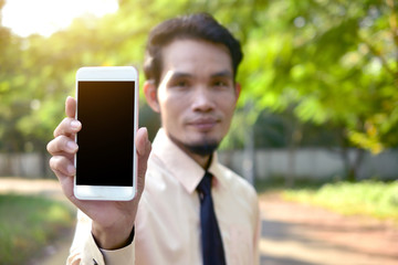 Businessman holding smart phone and using  internet online