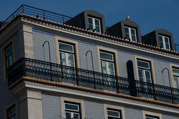 Old building facade with Lisbon traditional tiles. Lisbon, Portugal