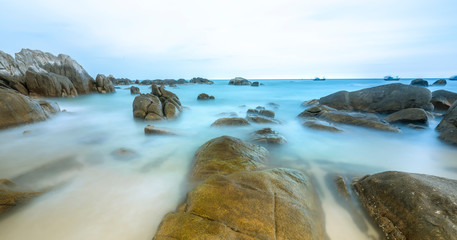 Ke Ga Lighthouse sunset with surf patted smoother reefs create clouds on the sea