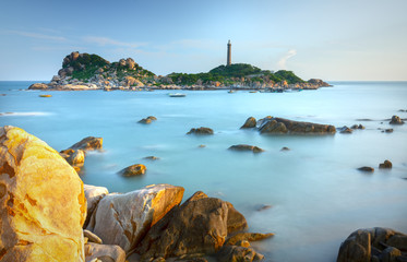 Ke Ga Lighthouse sunset with surf patted smoother reefs create clouds on the sea