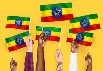 Hands waving flags of Ethiopia