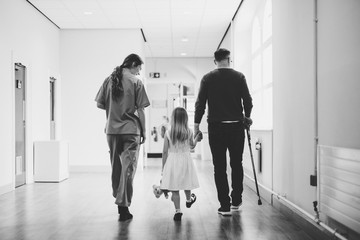 Daughter walking with her disabled father