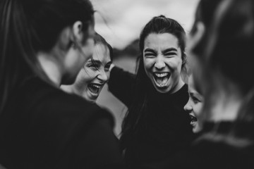 Excited girls on the football field - obrazy, fototapety, plakaty