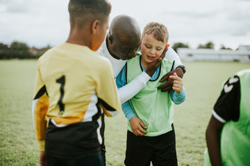 Football coach with his students © Rawpixel.com