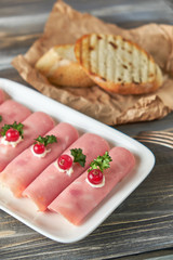 Ham roll ups stuffed with cheese, garlic and mayonnaise