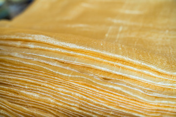 Yellow golden fabrics made of pure natural silk