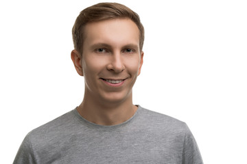 Happy male in simple gray t-shirt isolated portrait
