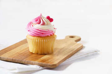 cupcake on wooden tray