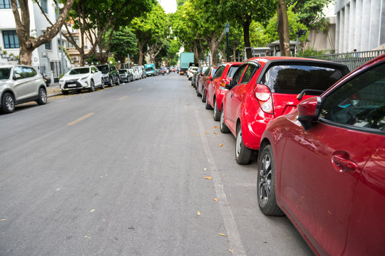 Parallel parking cars on urban street. Outdoor parking on road