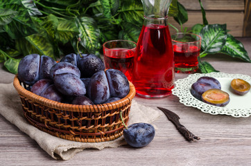 Fresh purple plums with water drops