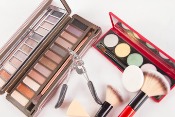 Set of decorative cosmetics on light colorful background