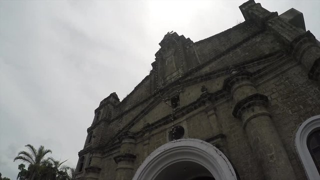 Colonial 18th century Spanish built Our Lady of Pillar of Alaminos, Laguna, Philippines showing her facade. Underside view, rotating tracking shot