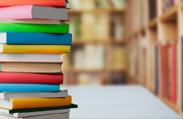 Old stacked books on wooden table