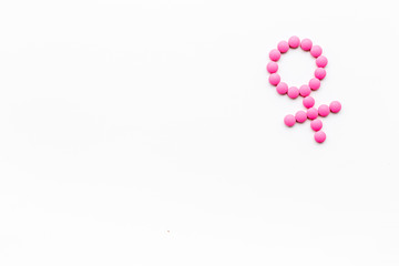 Female diseases. Female gender icon symbol made of pills on white background top view copy space