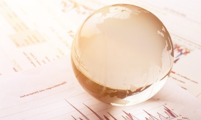 Glass globe ball on business report background