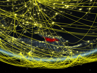 Georgia on model of planet Earth at night with network representing travel and communication.