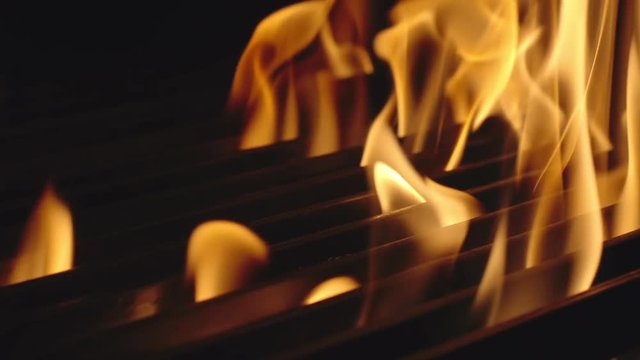 SLOW MOTION: Fire in barbecue grill - Close Up