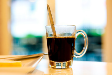 cup of black coffee on the morning table