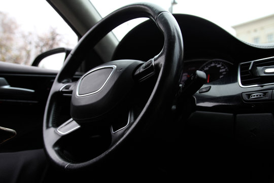 Steering wheel on the car dashboard and the driver's seat © Mashevur
